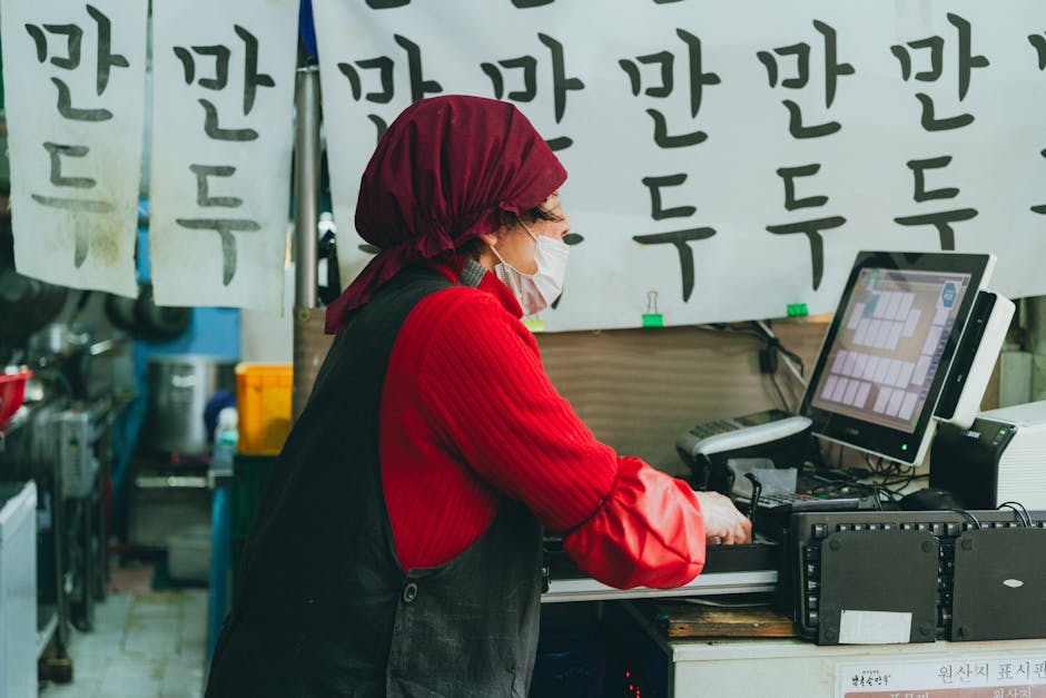A woman works in a Seoul street market surrounded