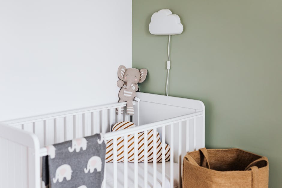 Modern baby room featuring a white crib soft deco