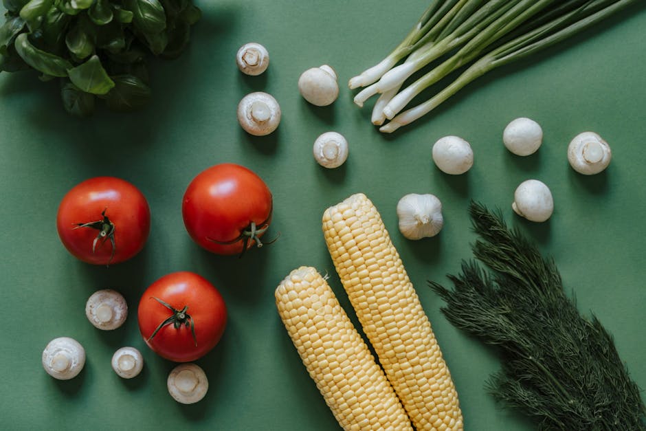 A top view of fresh vegetables including tomatoes
