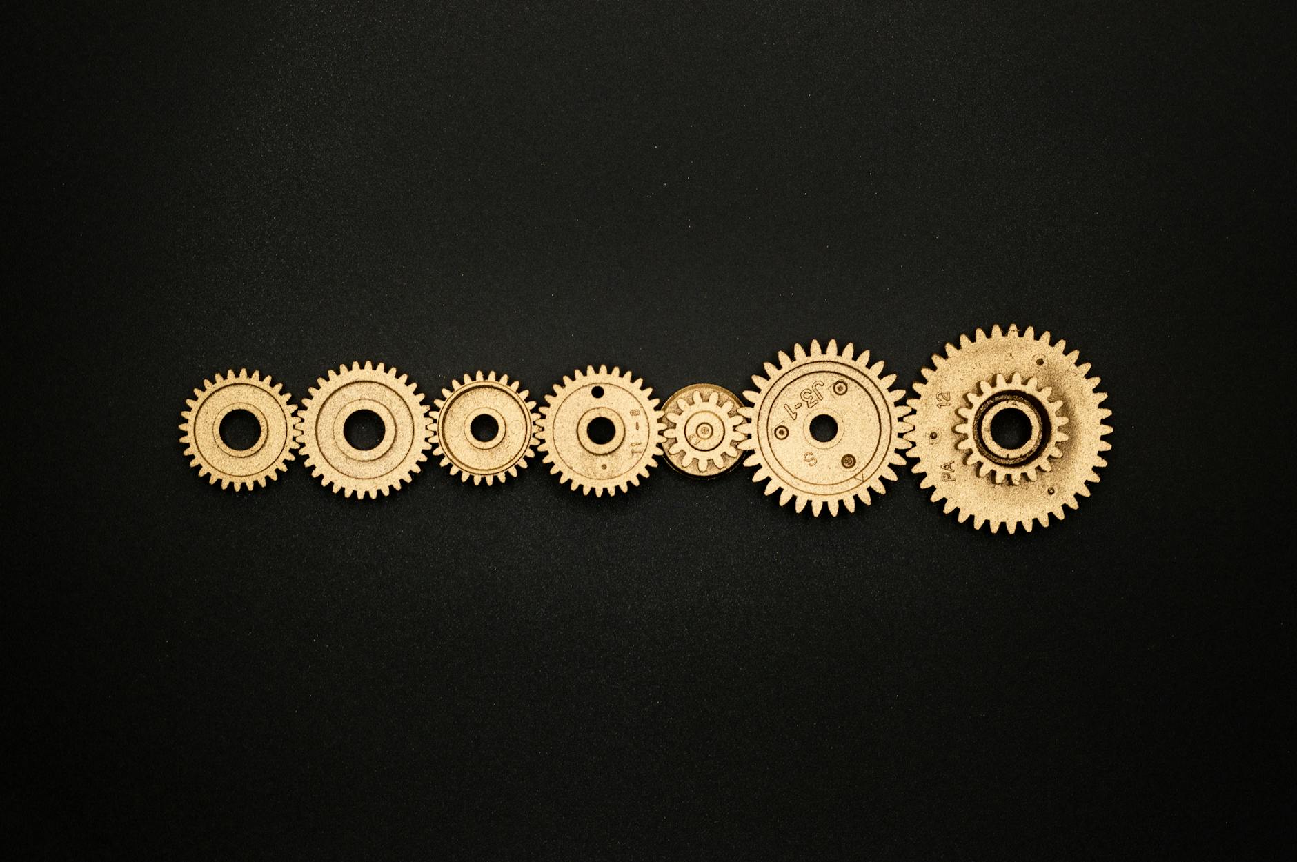 An artistic arrangement of golden gears on a dark