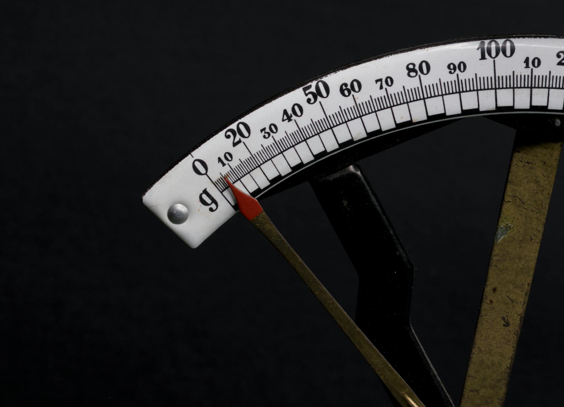 Detailed close up image of a vintage analog weighi