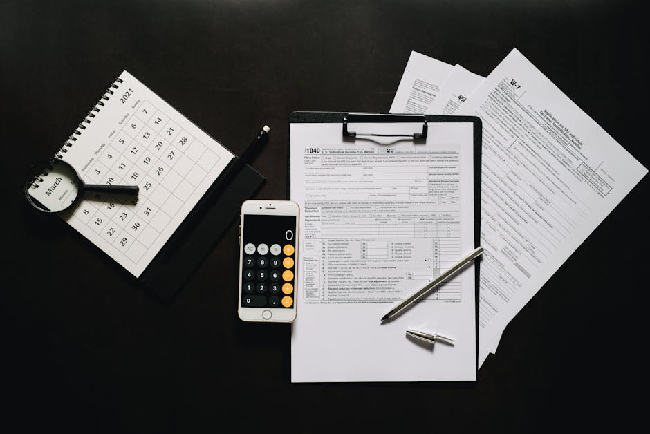 Flat lay of financial tools for tax preparation in 2