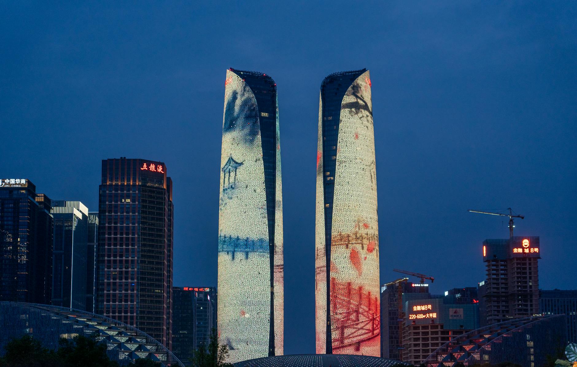 Night view of illuminated skyscrapers with artisti